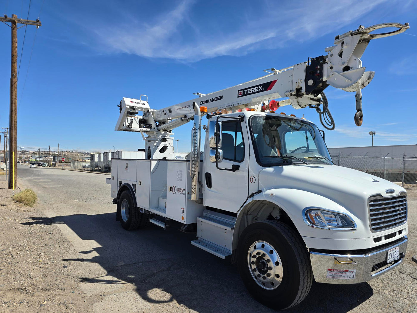Commercial utility truck transported through TSV driveaway service